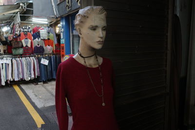 Mid adult man standing in store