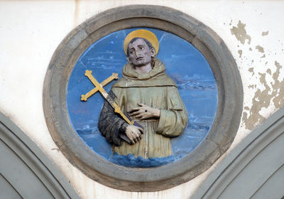 Low angle view of angel statue on church