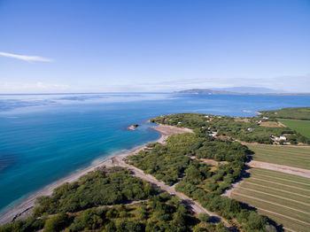 High angle view of sea against blue sky