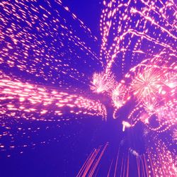 Abstract image of illuminated ferris wheel against sky at night