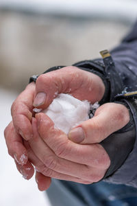 Close-up of hand holding water