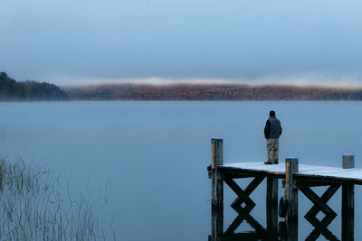 Pier over lake against sky