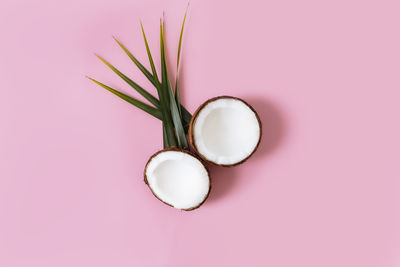 High angle view of pink eggs on white background
