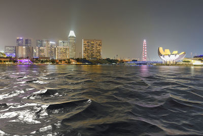 Illuminated buildings in city at night