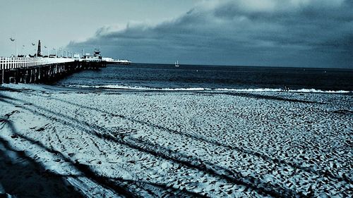 Scenic view of sea against cloudy sky