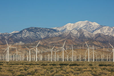 Scenic view of mountains against clear blue sky