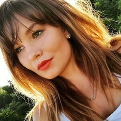 Close-up portrait of smiling young woman