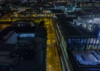 High angle view of illuminated buildings in city at night