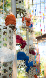 Low angle view of decoration hanging on plant for sale