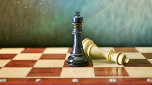 Close-up of chess pieces on table