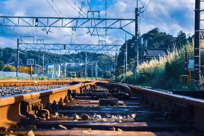 Train on railroad tracks against sky