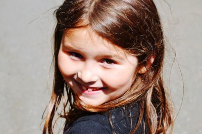 Close-up portrait of smiling girl