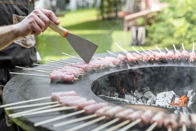 Cropped hand of man preparing food