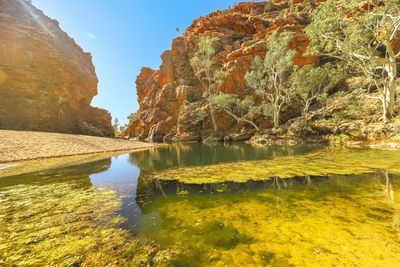 Scenic view of lake against rock formation