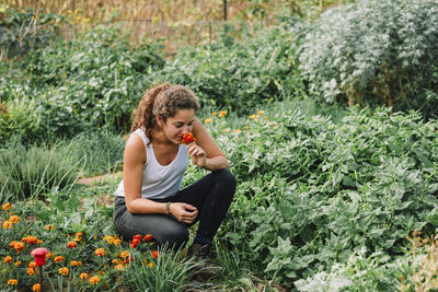 Young woman sitting on field