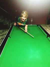 Woman playing with ball on table