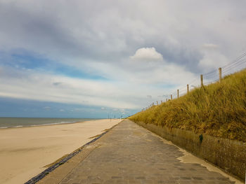 Road by sea against sky