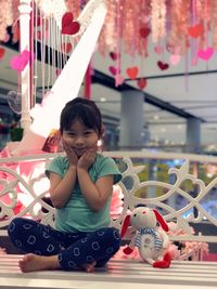 Portrait of cute girl relaxing on seat