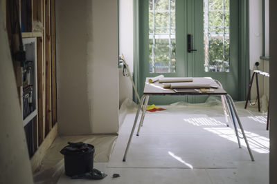 Blueprints over table at under construction apartment