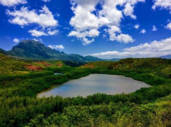 Scenic view of lake and mountains against sky
