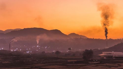 Scenic view of field against sky during sunset