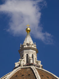 Low angle view of church and building against sky