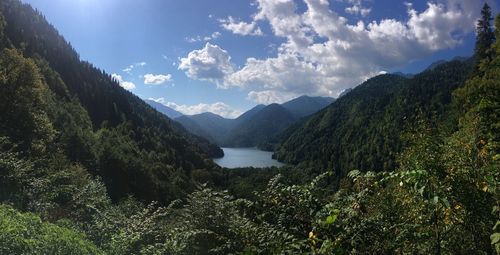 Scenic view of lake and mountains against sky