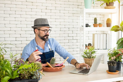 Young man using laptop on table