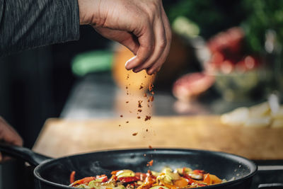 Close-up of chef preparing food in kitchen