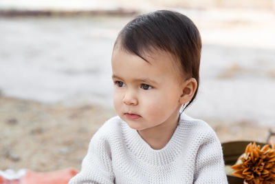 Portrait of cute boy looking away