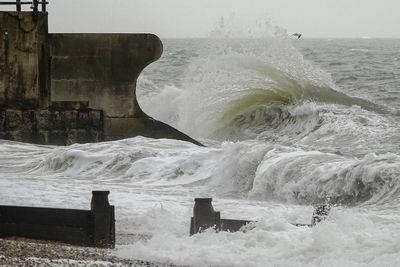 Scenic view of sea waves splashing on shore