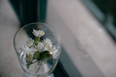 Close-up of white flower vase on table