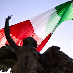 Low angle view of flag against sky