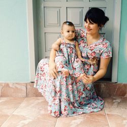 Full length of girl sitting on floor