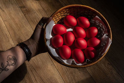 High angle view of tomatoes in basket on table