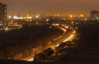 High angle view of city buildings at night