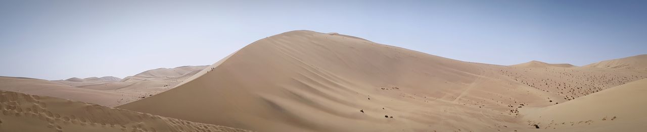 Scenic view of desert against clear sky