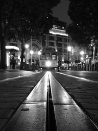 Surface level of road along buildings at night