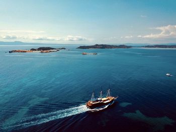 High angle view of sailboat sailing on sea against sky