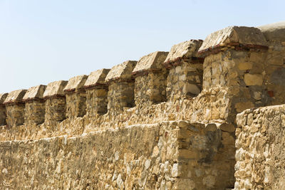 Low angle view of old ruins against clear sky