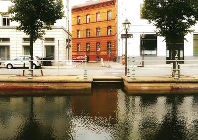 Reflection of building in puddle