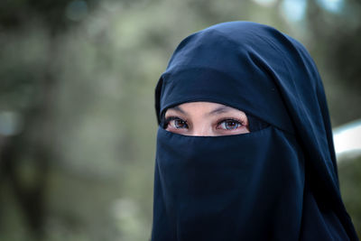 Close-up of woman wearing hat