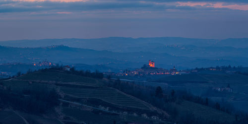 Scenic view of mountains against sky at dusk