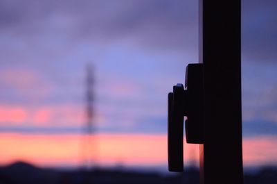 Close-up of silhouette against sky during sunset