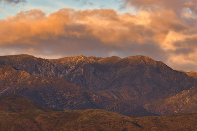 Scenic view of mountains against sky during sunset