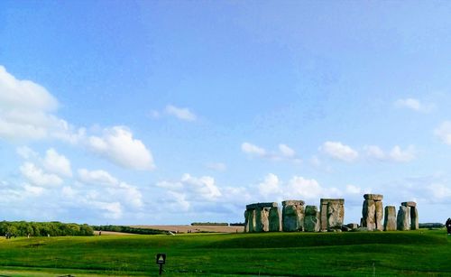 Built structure on field against sky