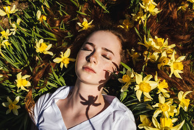 High angle view of girl by flowering plants