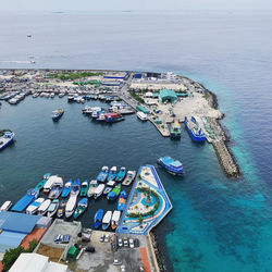 High angle view of boats moored at harbor