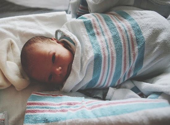 indoors, bed, baby, babyhood, childhood, relaxation, lifestyles, innocence, close-up, toddler, high angle view, unknown gender, home interior, person, leisure activity, bedroom, newborn