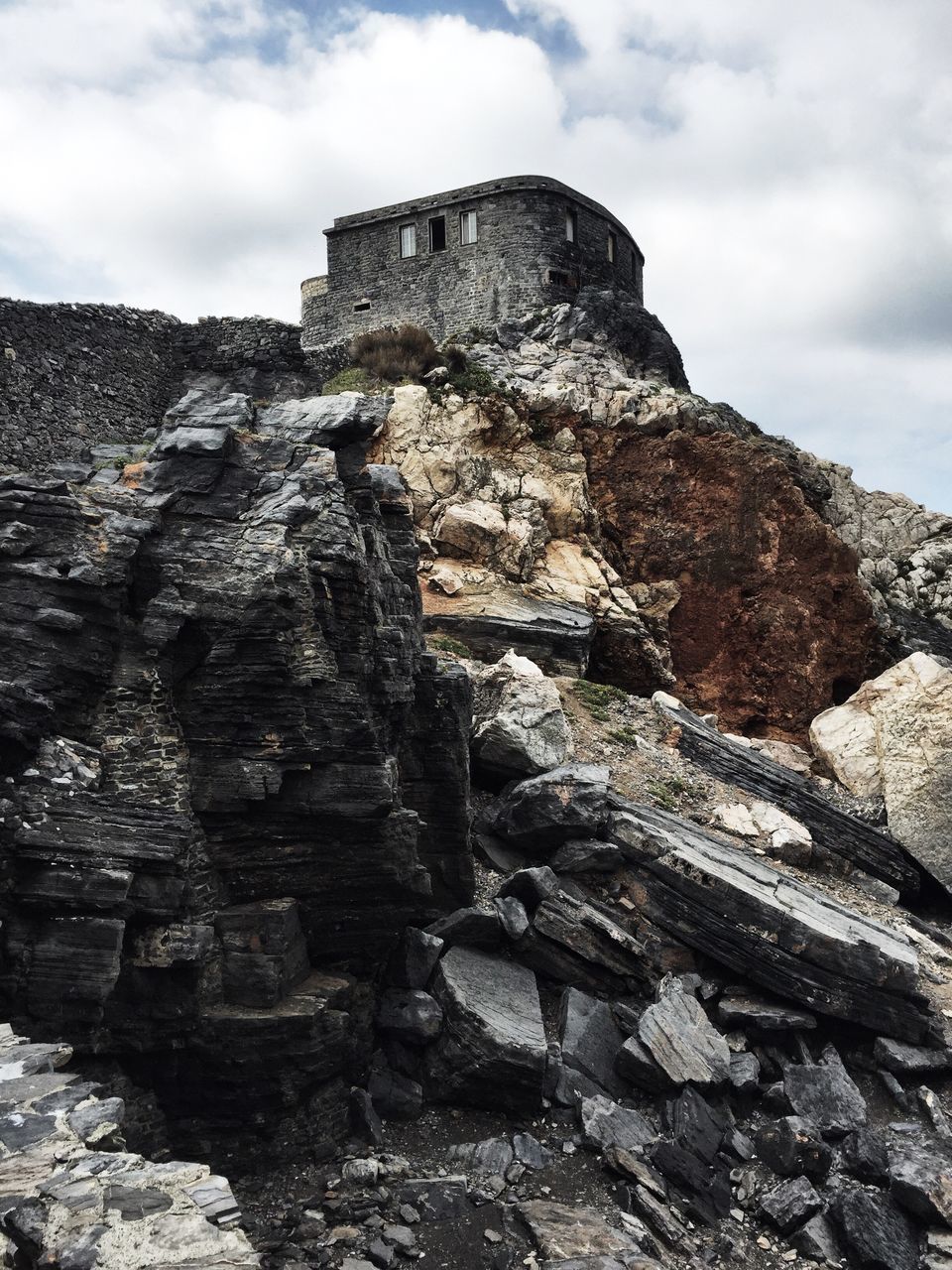 LOW ANGLE VIEW OF CASTLE ON ROCK